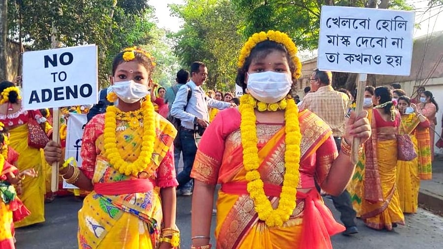 Children wearing a mask take part in an awareness campaign against Adenovirus. Credit: IANS Photo