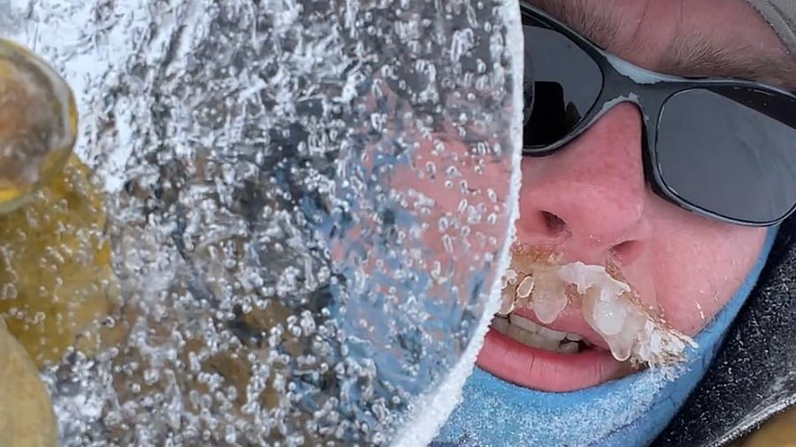 This undated handout photograph taken in Antarctica shows US glaciologist Peter Neff holding a piece of ice excavated from Antarctica's Allan Hills. Credit: AFP Photo
