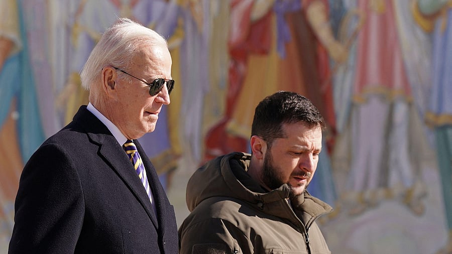 US President Joe Biden (L) walks next to Ukrainian President Volodymyr Zelensky (R) as he arrives for a visit in Kyiv on February 20, 2023. Credit: AFP Photo
