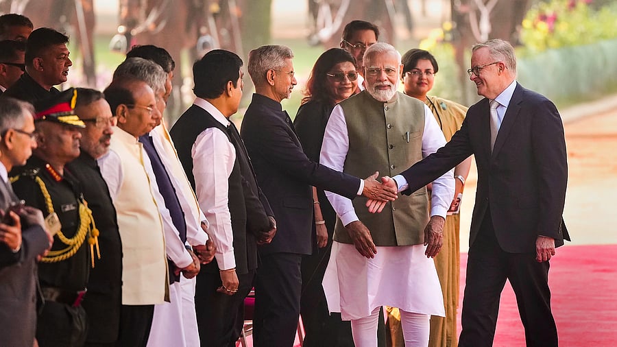 Prime Minister of Australia Anthony Albanese shakes hand with External Affairs Minister S. Jaishankar as Prime Minister Narendra Modi looks on during his ceremonial reception at the Rashtrapati Bhavan, in New Delhi, Friday, March 10, 2023. Credit: PTI Photo