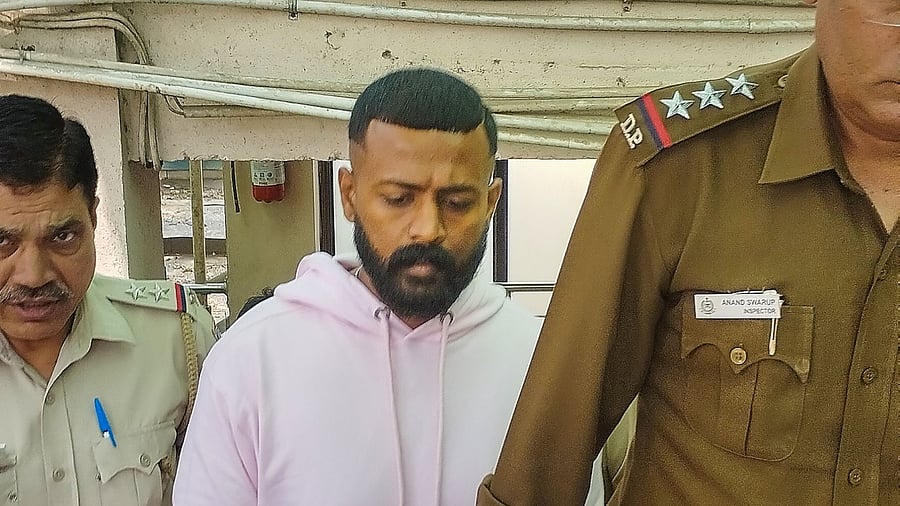 Alleged conman Sukesh Chandrashekhar being produced at Patiala House court in connection with a money laundering case, in New Delhi, Friday, March 10, 2023. Credit: PTI Photo