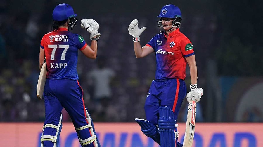 Delhi Capitals' Jess Jonassen and Marizanne Kapp celebrate after winning the 2023 WPL Twenty20 cricket match between Delhi Capitals and Royal Challengers Bangalore. Credit: AFP Photo