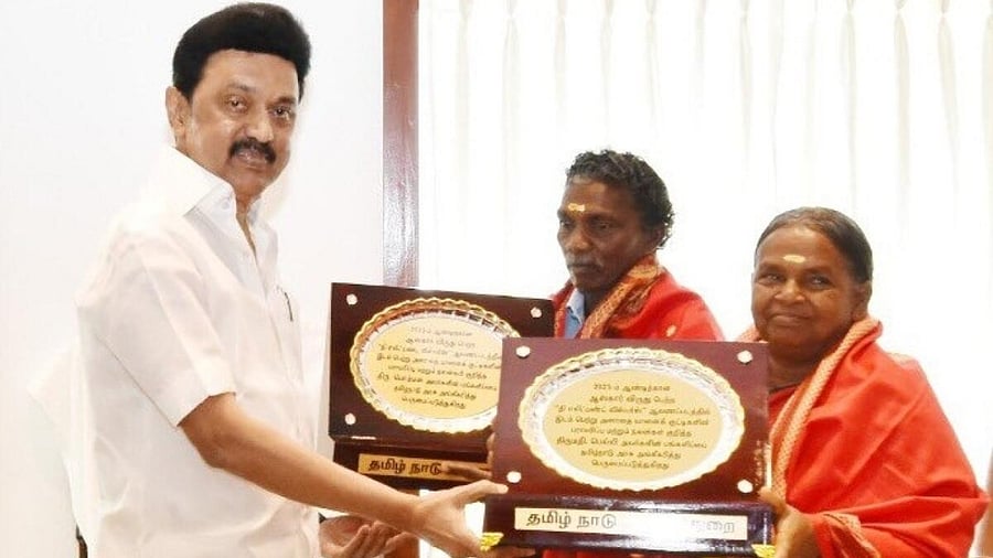 Stalin felicitates elephant whisperers Bomman and Bellie. Credit: IANS Photo