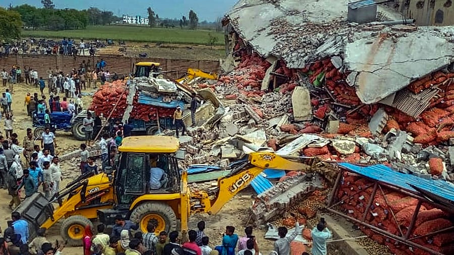 Rescue work underway after the roof of a cold storage collapsed in Chandausi area of Sambhal district in Uttar Pradesh. Credit: PTI Photo