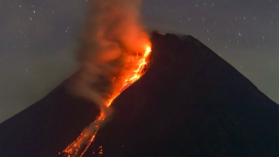 Mount Merapi volcano spews lava from its crater as seen from Sleman in Yogyakarta early on March 18, 2023. Credit: AFP Photo