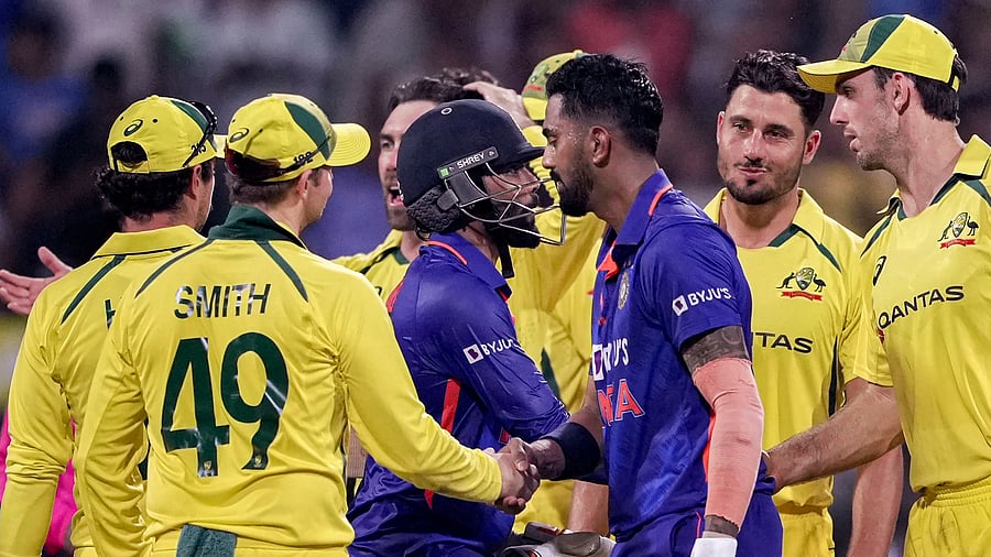 KL Rahul (R) and Ravindra Jadeja (C) run between the wickets during the first one-day international (ODI) cricket match between India and Australia at the Wankhede Stadium. Credit: PTI Photo