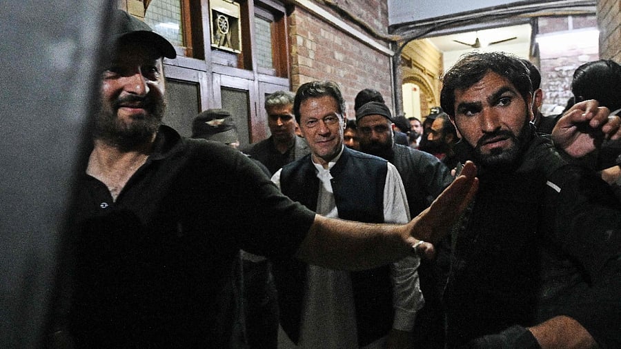 Pakistan's Prime Minister Imran Khan as he leaves after appearing at the high court in Lahore. Credit: AFP Photo