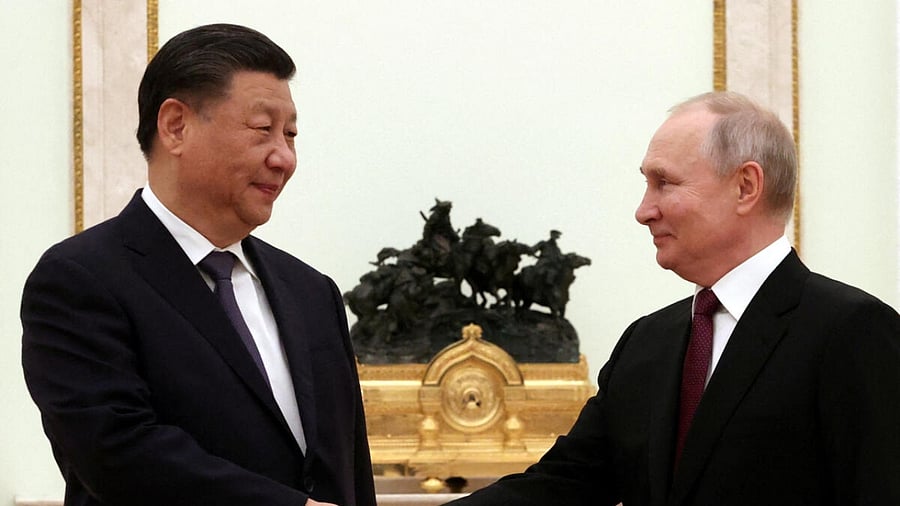 Russian President Vladimir Putin shakes hands with Chinese President Xi Jinping during a meeting at the Kremlin in Moscow, Russia, March 20, 2023.  Credit: Reuters Photo