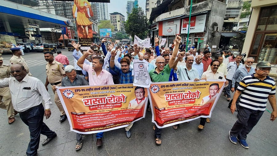 Maharashtra government employees raise slogans during a protest to demand restoration of the old pension scheme. Credit: PTI Photo