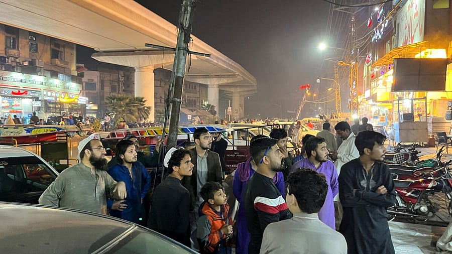 People come out of a restaurant after a tremor was felt in Lahore. Credit: Reuters Photo