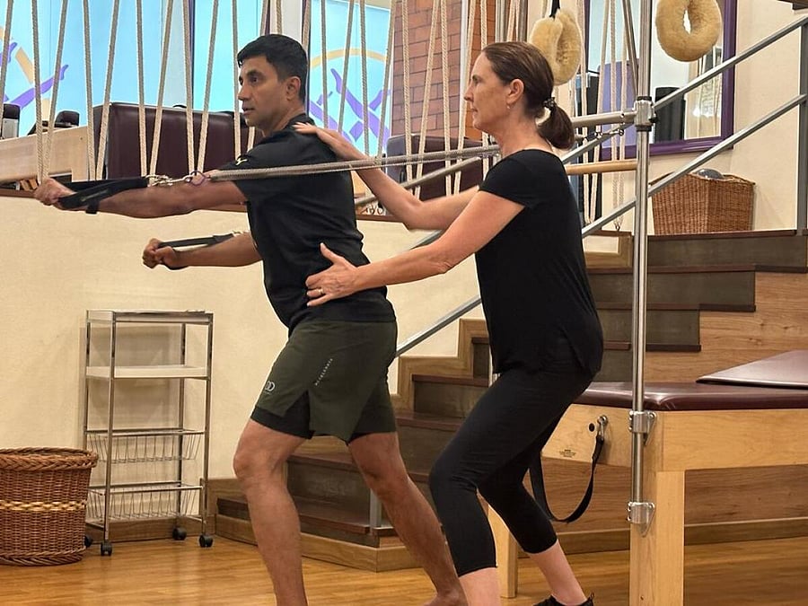 Amy Taylor Alpers (right) conducts a pilates session.