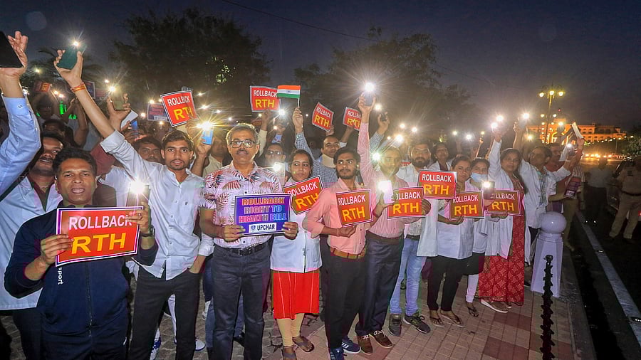 Doctors take part in a torch march against Rajasthan's 'Right to Health Bill', at Amar Jawan Jyoti in Jaipur, Friday, March 24, 2023. Credit: PTI Photo