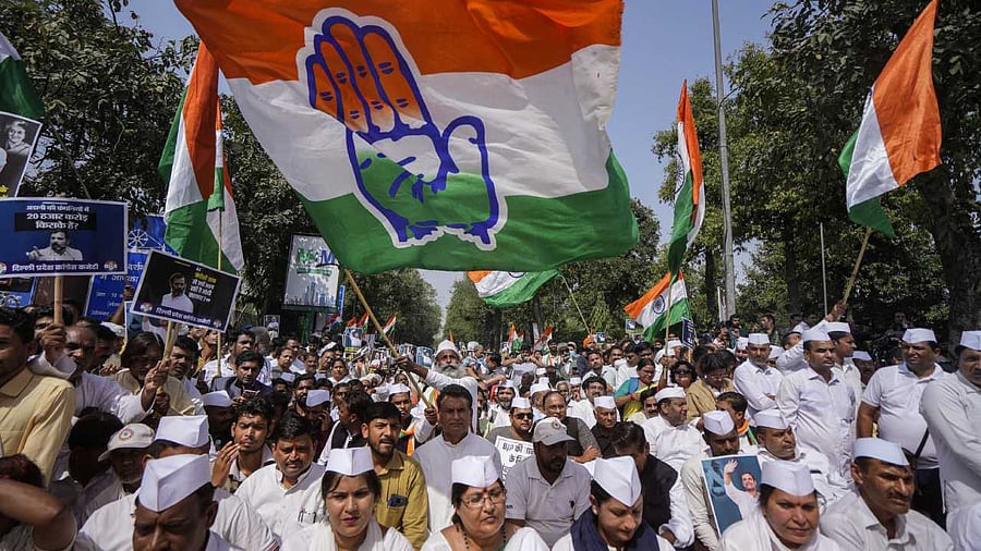 Congress supporters during the party's 'Satyagraha' against disqualification of Congress leader Rahul Gandhi from the Lok Sabha, at Rajghat in New Delhi. Credit: PTI Photo