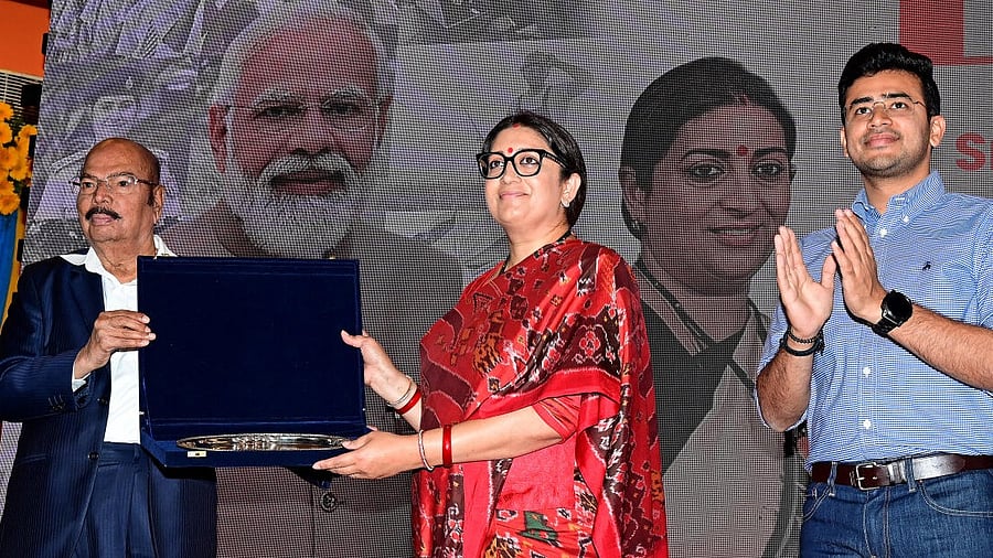 PES University vice chancellor Dr M R Doreswamy presents a memento to Union Minister Smriti Irani at the "Yuva Samvada - A Conversation with First Time Voters" organised by BJP Yuva Morcha, at the varsity in Bengaluru on Monday. Credit: Special Arrangement