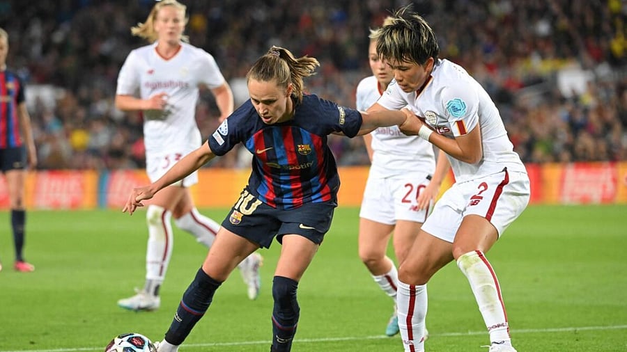 Barcelona's Norwegian forward Caroline Graham (L) vies with AS Roma's Japanese defender Moeka Minami during the UEFA Women's Champions League quarter-final. Credit: AFP Photo