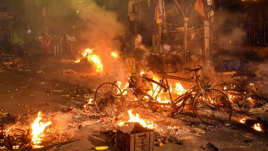 Vehicles set on fire by miscreants during clashes between two groups, at Kajipara in Howrah district. Credit: PTI Photo