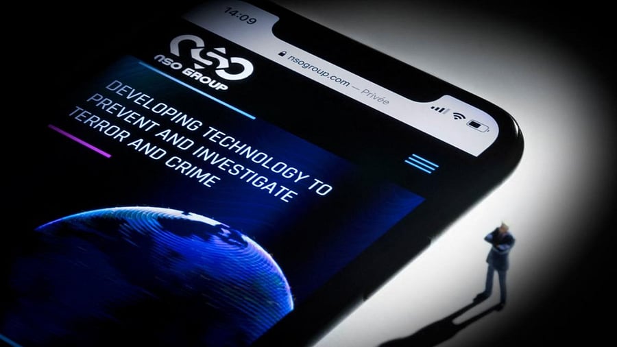 Illustration shows a smartphone with the website of Israel's NSO Group which features 'Pegasus' spyware. Credit: AFP Photo