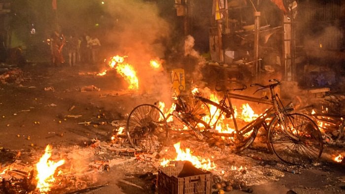 Vehicles set on fire by miscreants during clashes between two groups, at Kajipara in Howrah district, Thursday, March 30, 2023. Credit: PTI Photo 