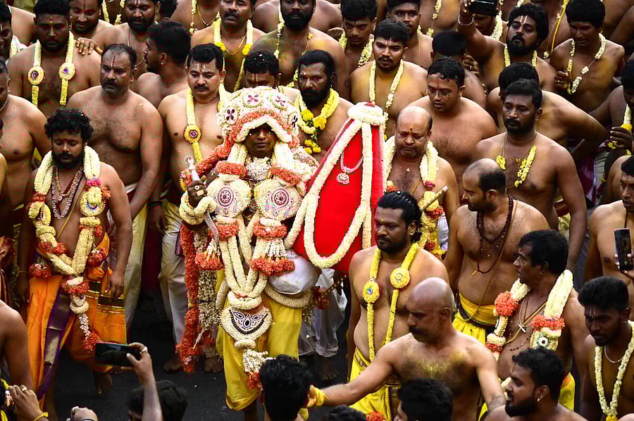 The head priest takes out a procession to the Shri Dharmaraya Swamy temple in Thigalarpet. Credit: DH PHOTO/Kishor Kumar Bolar