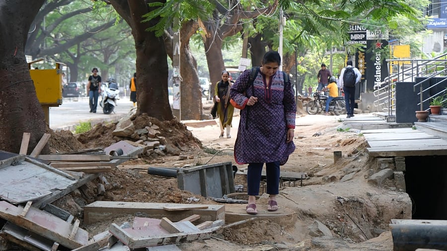 Lack of footpaths and uneven sidewalks inconveniences pedestrians. This image is from 100 Ft Road, Indiranagar. DH FILE Photo