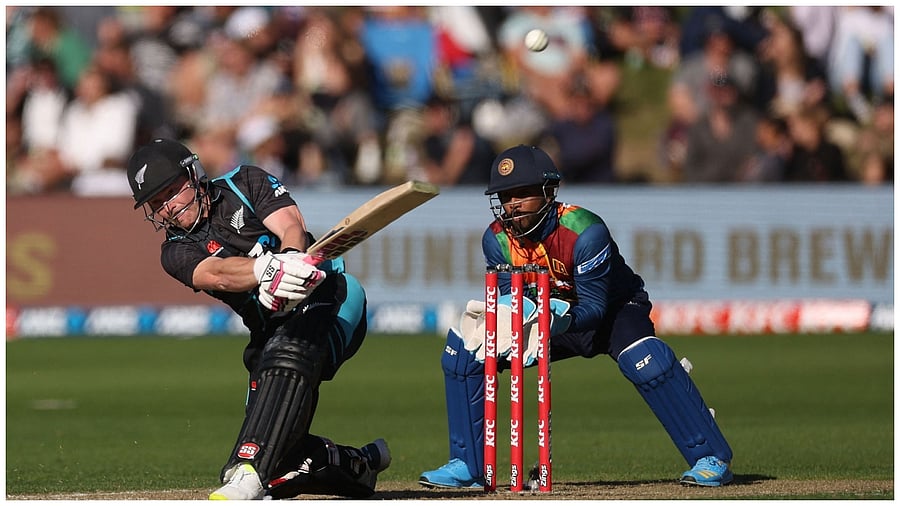 New Zealand's Tim Seifert (L) plays a shot as Sri Lanka's wicketkeeper Kusal Mendis reacts during the third Twenty20 cricket match. Credit: AFP Photo