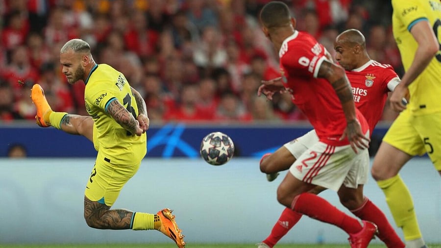 Inter Milan's Italian defender Federico Dimarco (L) challenges Benfica's Portuguese midfielder Joao Mario (R) during the UEFA Champions League quarter final first leg football match between SL Benfica and Inter Milan at the Luz stadium in Lisbon on April 11, 2023. Credit: AFP Photo