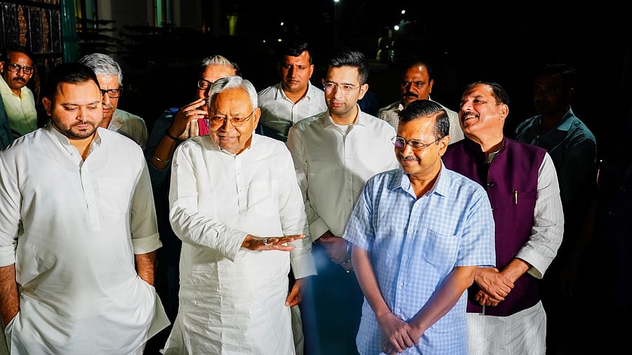 Delhi Chief Minister Arvind Kejriwal with Bihar Chief Minister Nitish Kumar and Bihar Deputy Chief Minister Tejashwi Yadav addresses the media after a meeting, in New Delhi, Wednesday, April 12, 2023. Credit: PTI Photo
