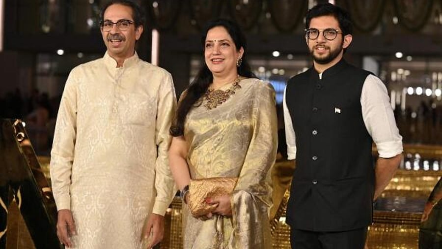 Rashmi Thackeray (centre) with husband Uddhav (left) and son Aaditya (right). Credit: AFP Photo