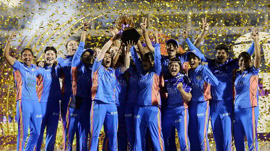 Women's Premier League Final - Mumbai Indians v Delhi Capitals - Brabourne Stadium, Mumbai, India - March 26, 2023. Mumbai Indians' players celebrate as they lift the Women's Premier League (WPL) trophy. Credit: Reuters Photo