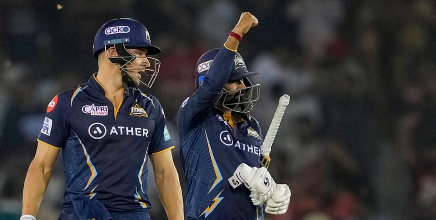 Gujarat Titans batters David Miller and Rahul Tewatia celebrate after winning their IPL 2023 cricket match against Punjab Kings. Credit: PTI Photo