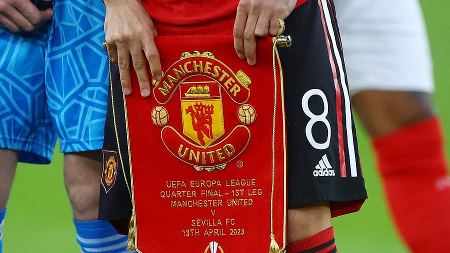 Manchester United's Bruno Fernandes holds a pennant before the match vs Sevilla. Credit: Reuters Photo