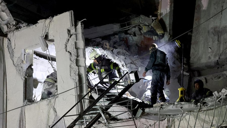 Firefighters work at a site of a Russian military strike, amid Russia's attack on Ukraine, in Sloviansk, Donetsk region. credit: Reuters Photo