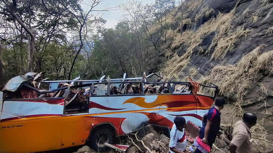 Wrecked remains of a bus that fell into a gorge that left 13 dead and over 25 injured. Credit: PTI Photo