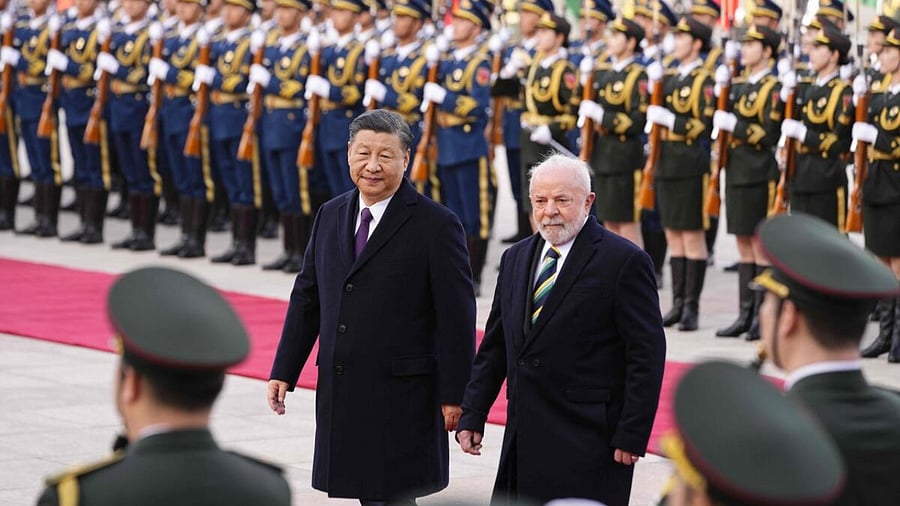 Chinese President Xi Jinping (L) and Brazil's President Luiz Inacio Lula da Silva attend a welcome ceremony at the Great Hall of the People in Beijing. Credit: AFP Photo