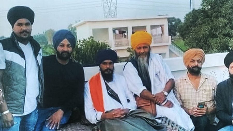 Waris Punjab De' chief Amritpal Singh's main aide Joga Singh (yellow turban). Credit: PTI Photo
