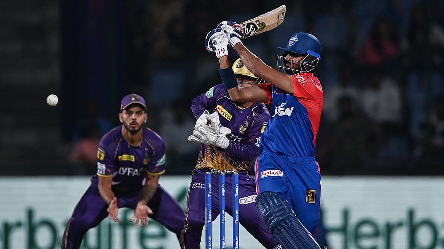 Delhi Capitals' Axar Patel (R) plays a shot during the Indian Premier League (IPL) Twenty20 cricket match between Delhi Capitals and Kolkata Knight Riders. Credit: AFP Photo