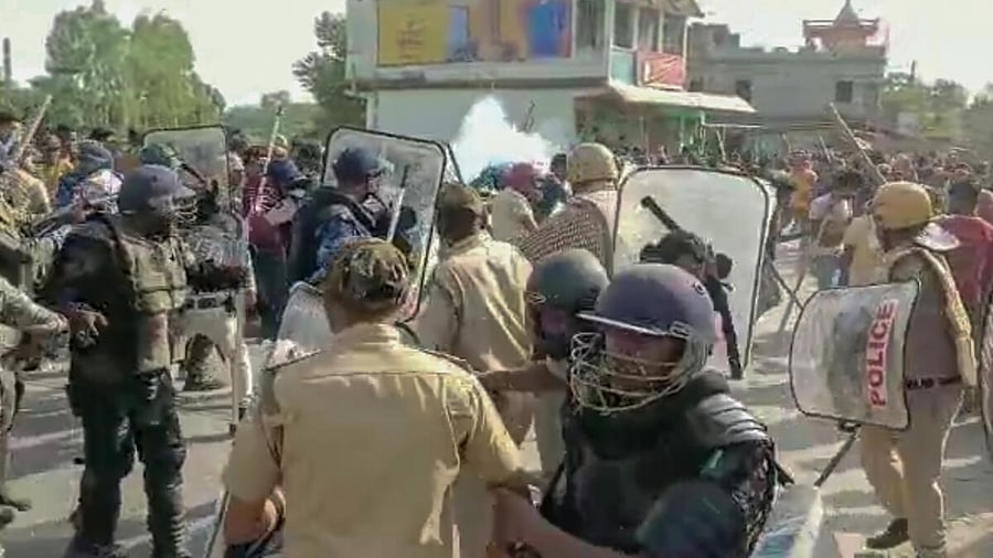 Security personnel try to control the situation after violent protests by locals over the death of a minor girl, in North Dinajpur district of West Bengal, Saturday, April 22, 2023. Credit: PTI Photo