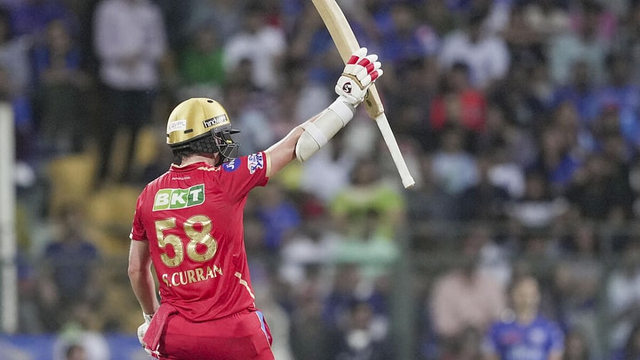 Punjab Kings batter Sam Curran celebrates his fifty during the IPL 2023 cricket match between Punjab Kings and Mumbai Indians. Credit: PTI Photo