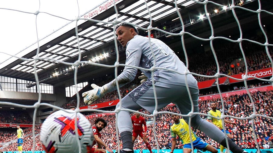 Liverpool's Mohamed Salah scores their third goal past Nottingham Forest's Keylor Navas. credit: Reuters Photo