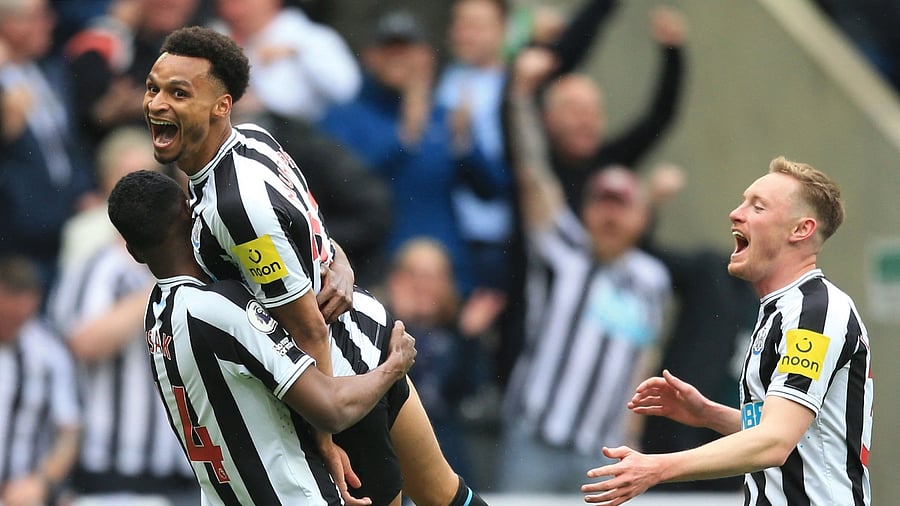 Newcastle United's English midfielder Jacob Murphy (C) celebrates scoring the team's third goal. Credit: AFP Photo