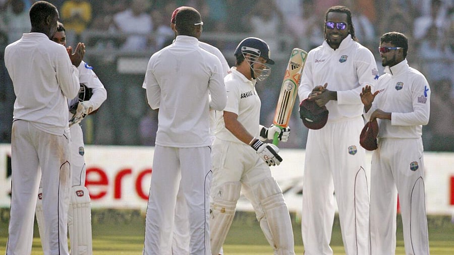 West Indian players pay their respects to Sachin Tendulkar as he arrives to bat in his last Test at the Wankhede Stadium in Mumbai. PTI File Photo