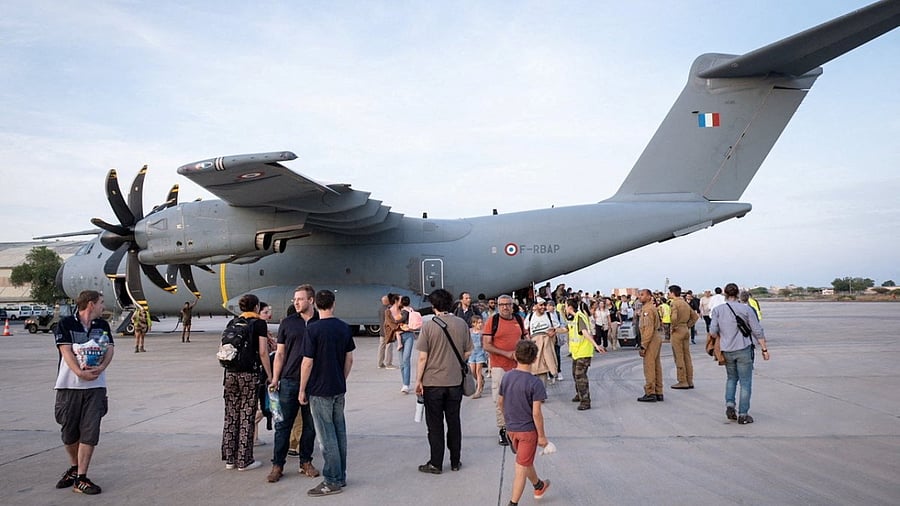 An French Air Force aircraft, which picked up evacuees of different nationalities from Sudan, arrives in Djibouti. Credit: French President Emmanuel Macron via Twitter/Handout via Reuters Photo