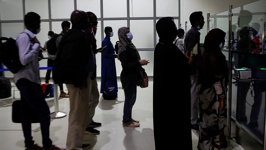 Evacuees from war-torn Sudan queue to be processed at immigration after disembarking from a military plane upon their arrival at the Jomo Kenyatta International Airport, in Nairobi, Kenya, April 24, 2023. Credit: Reuters Photo
