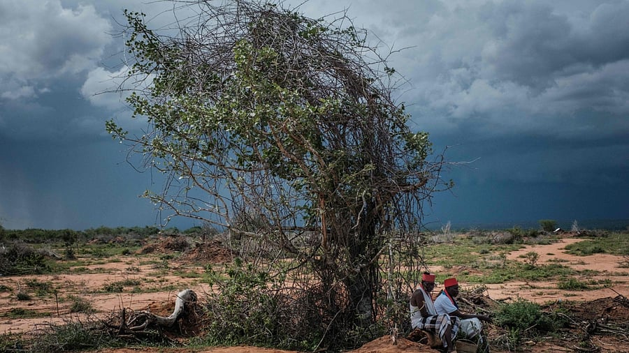 The local spiritual leaders from Kaya-Giriama ethnic group wait for the transport to visit the mass-grave site in the forest in Shakahola, outside the coastal town of Malindi, on April 24, 2023. The death toll in a case involving a Kenyan cult that practised starvation climbed to 73 on April 24, 2023, police sources told AFP as investigators unearthed more corpses from mass graves in a forest near the coast. Credit: AFP Photo