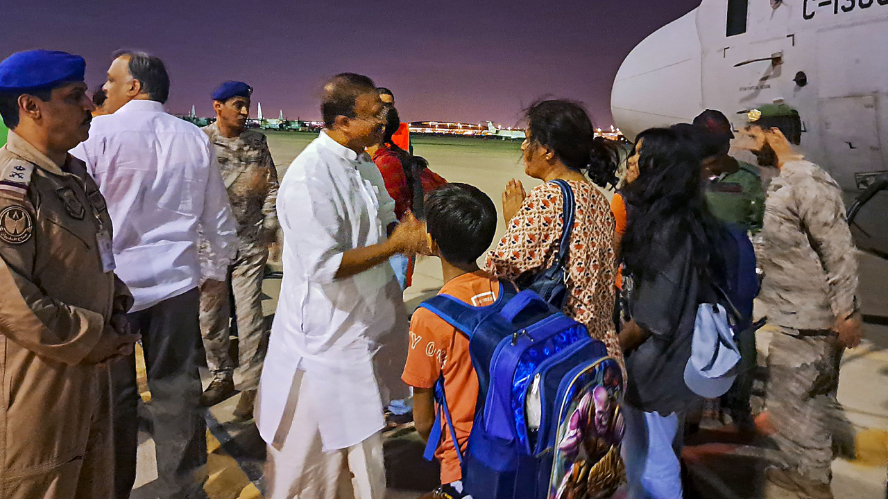 Minister of State for External Affairs V Muraleedharan receives the 8th batch of stranded Indians in Jeddah, Saudi Arabia. Credit: PTI Photo