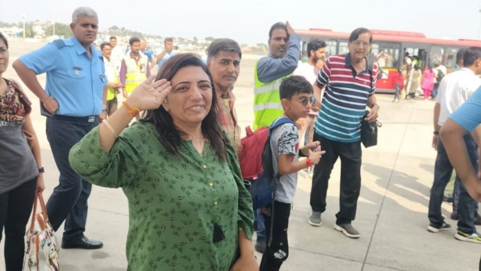 An Indian evacuee from Sudan salutes upon arrival. Credit: Special Arrangement 