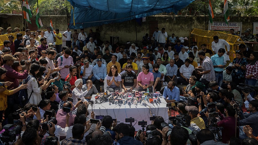Indian wrestlers take part in a sit-in protest demanding arrest of WFI chief, who they accuse of sexually harassing female players, in New Delhi. Credit: Reuters Photo