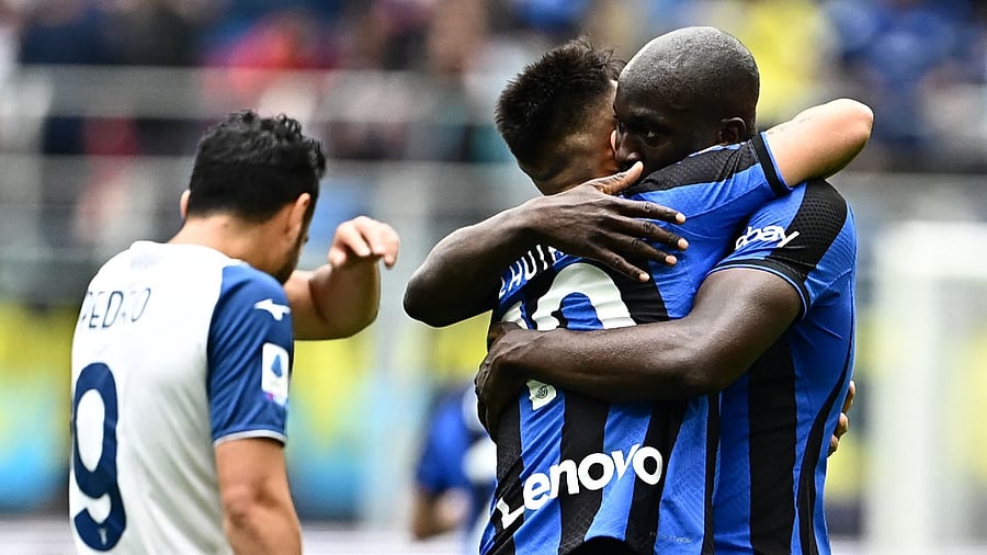 Inter Milan's Argentinian forward Lautaro Martinez (C) celebrates scoring his team's first goal. Credit: AFP Photo