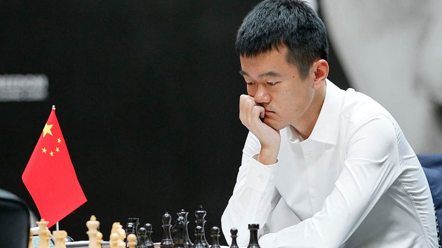 Grandmaster Ding Liren from China competes during the first game of a 14-game match to decide who will be the new 17th World Chess Champion in Astana. Credit: AFP Photo