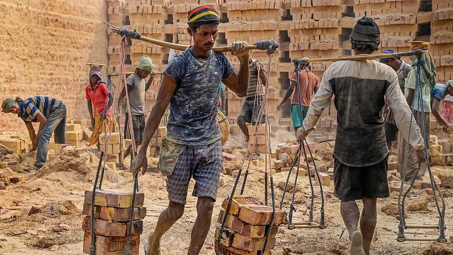 Labourers work at a brick factory on the occasion of Labour Day, in Nadia, West Bengal, May 1, 2023. Labour Day is often a privilege enjoyed only by organized labour. Credit: PTI Photo